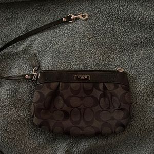 black COACH wrist wallet. Used once for an event. Basically new.No signs of wear